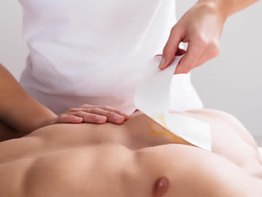 person having chest waxed