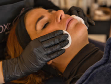 person receiving facial treatment